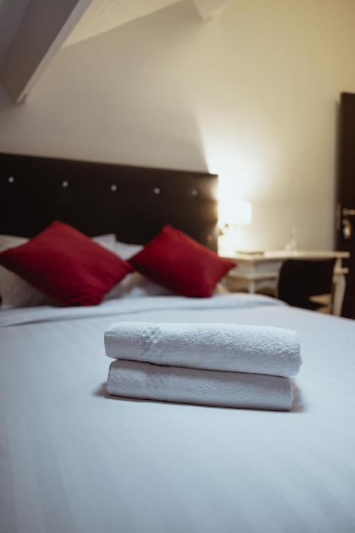 Postel nebo postele na pokoji v ubytování Hotel Le Centenaire Brussels Expo