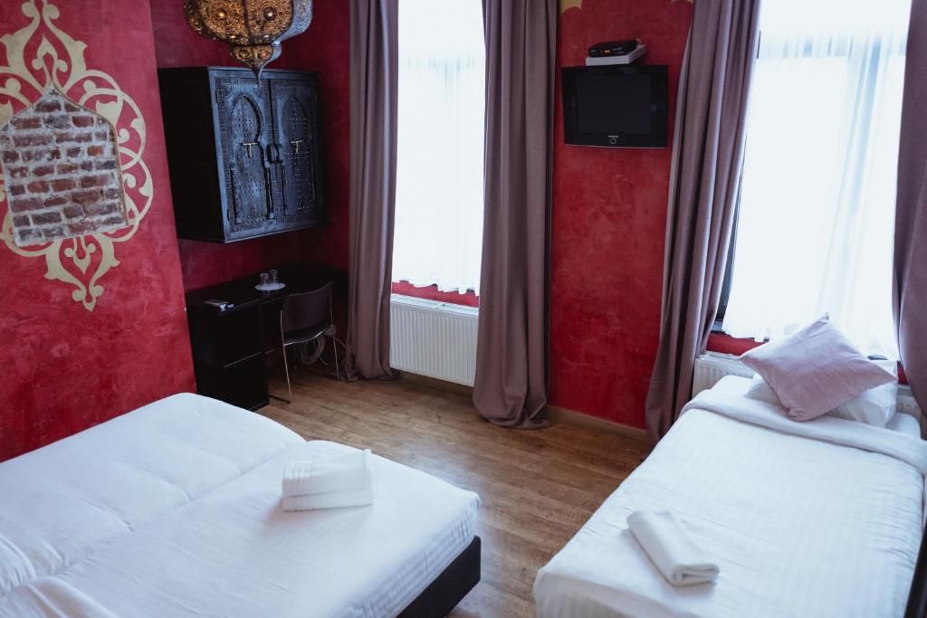 Postel nebo postele na pokoji v ubytování Hotel Le Centenaire Brussels Expo