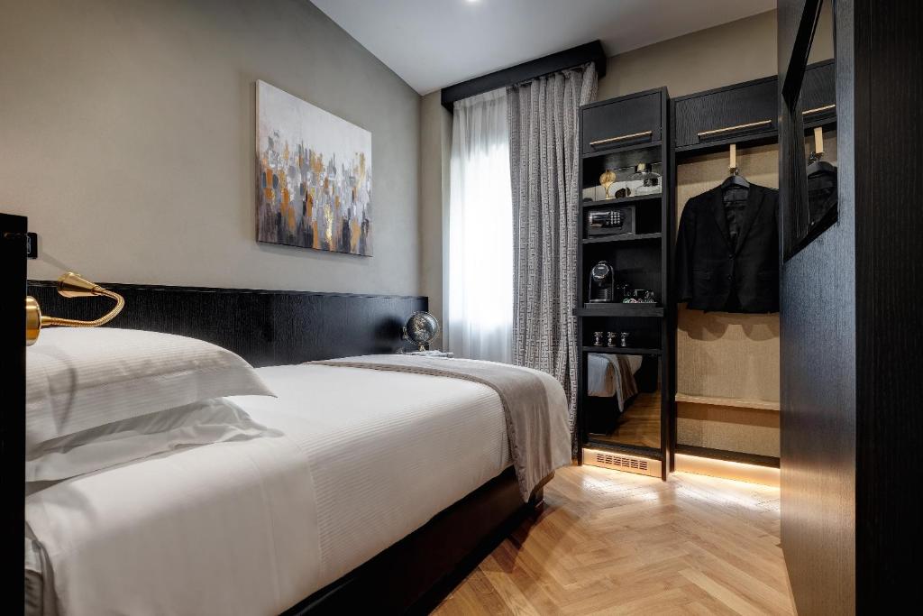 A bed or beds in a room at Dharma Boutique Hotel & SPA