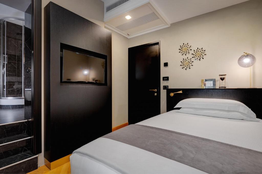A bed or beds in a room at Dharma Boutique Hotel & SPA