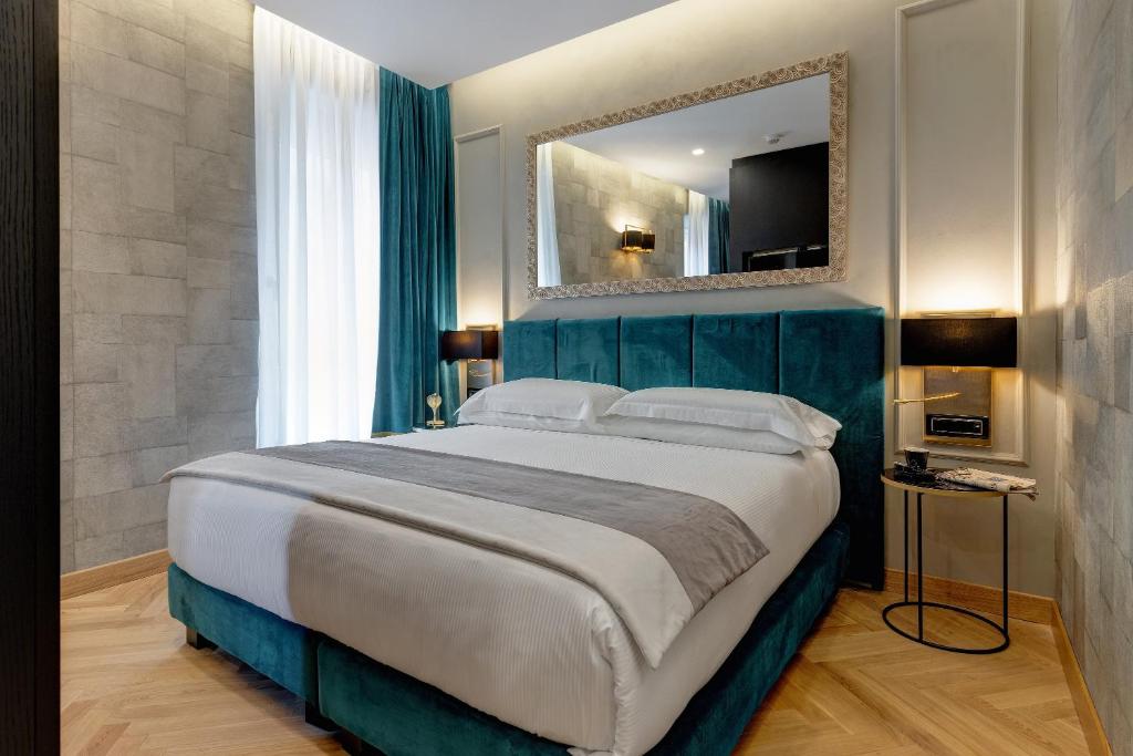 A bed or beds in a room at Dharma Boutique Hotel & SPA