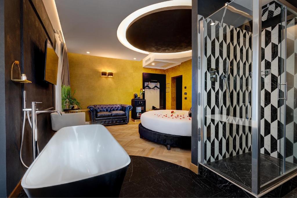 A bed or beds in a room at Dharma Boutique Hotel & SPA
