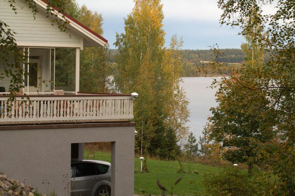 a car parked on the porch of a house at Willa Rautalahti in Rautalahti