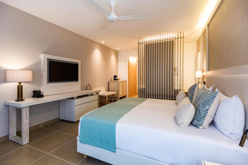 Postel nebo postele na pokoji v ubytování Hotel Irotama Lago