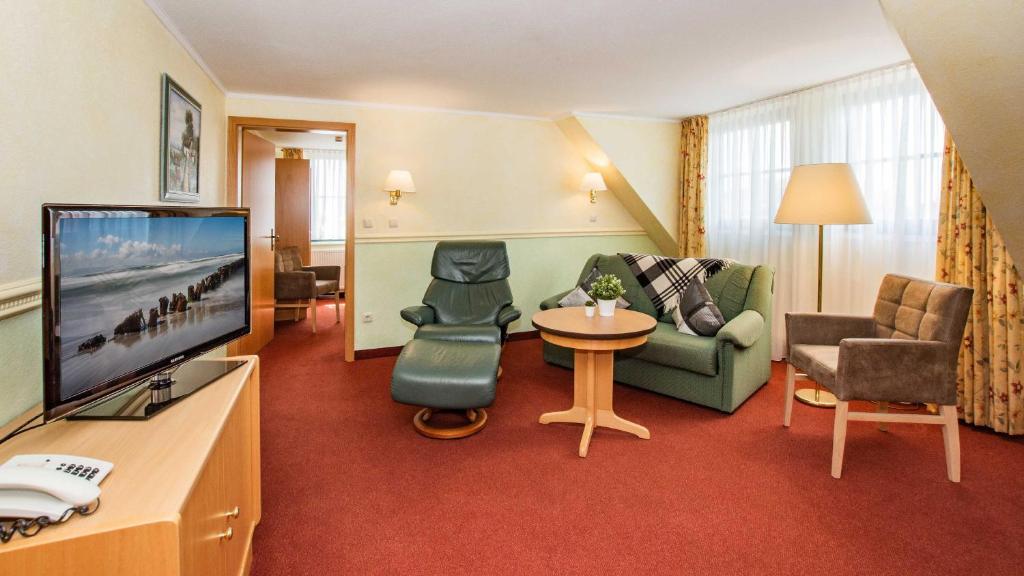 TV a/nebo společenská místnost v ubytování Hotel Garni Nussbaumhof