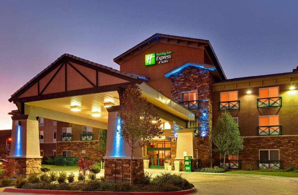 a large building with a clock on the front of it at Holiday Inn Express Tehachapi, an IHG Hotel in Tehachapi
