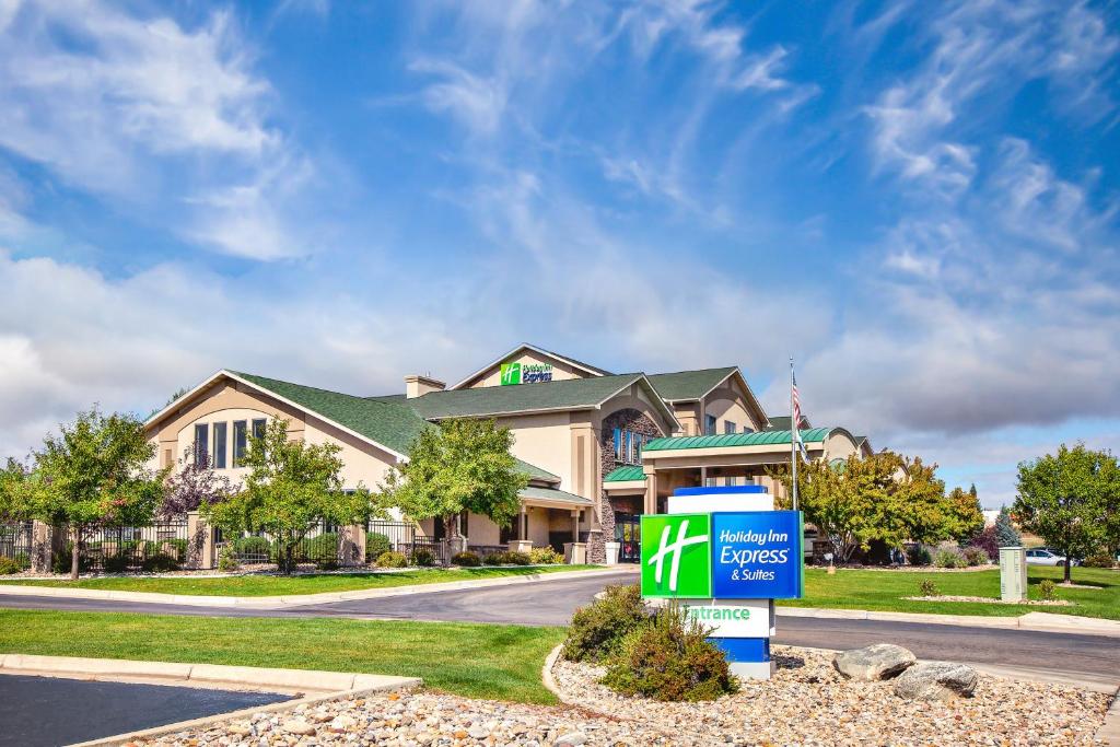 a house with a sign in front of a house at Holiday Inn Express Hotel & Suites Gillette, an IHG Hotel in Gillette