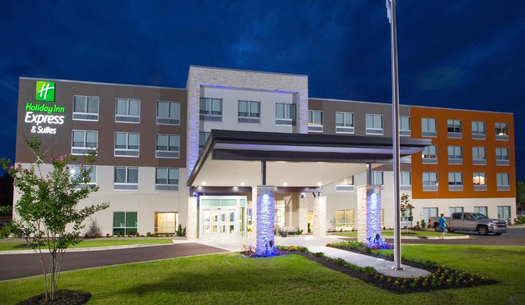 an exterior view of a hotel with a building at Holiday Inn Express & Suites Greenwood Mall by IHG in Greenwood