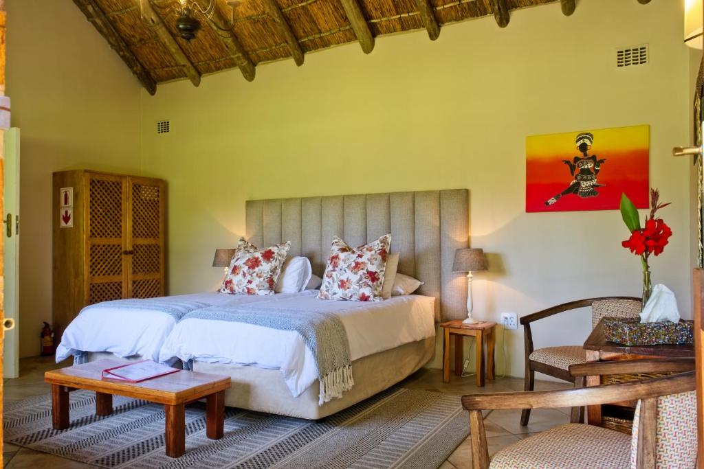 Postel nebo postele na pokoji v ubytování Chrislin African Lodge