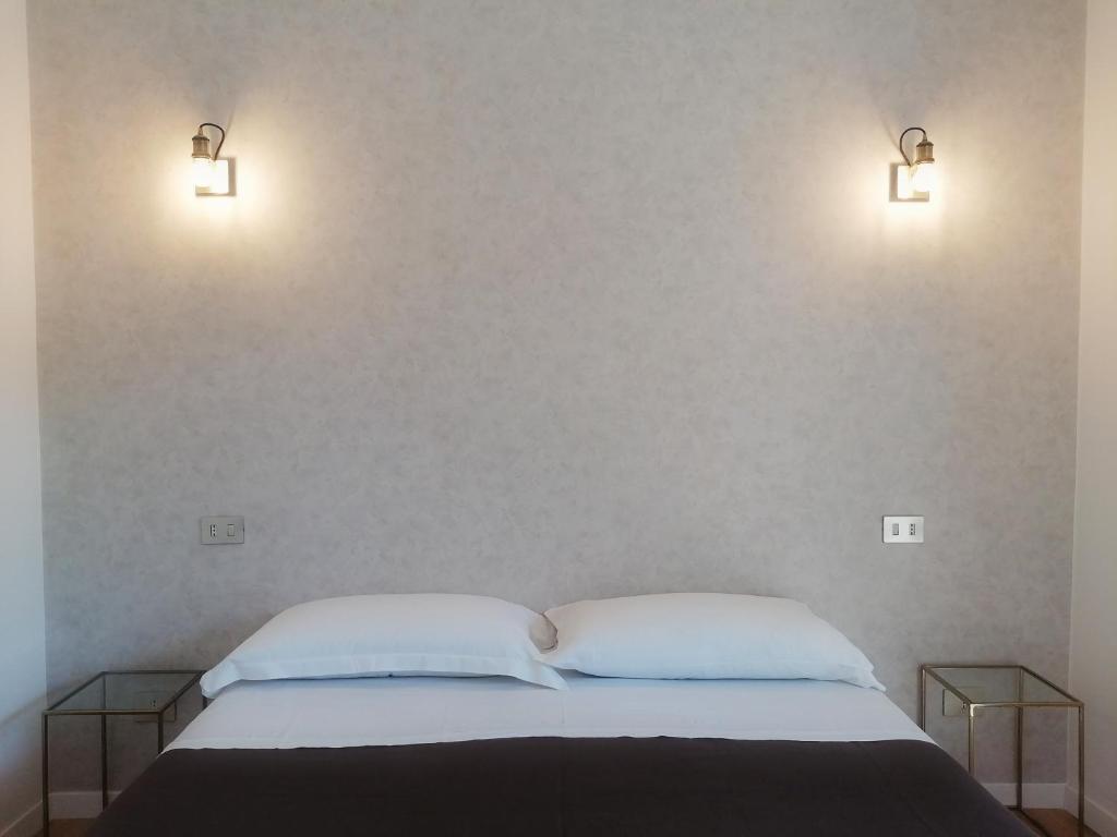 A bed or beds in a room at Guest House Arte