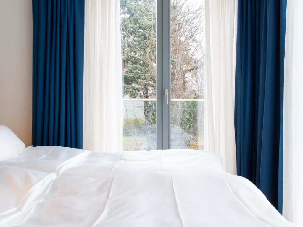 Postel nebo postele na pokoji v ubytování Premium Green Apartments Vienna