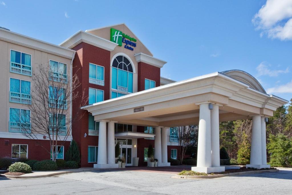 a rendering of a hotel with a building at Holiday Inn Express Hotel & Suites Greenville-I-85 & Woodruff Road, an IHG Hotel in Greenville