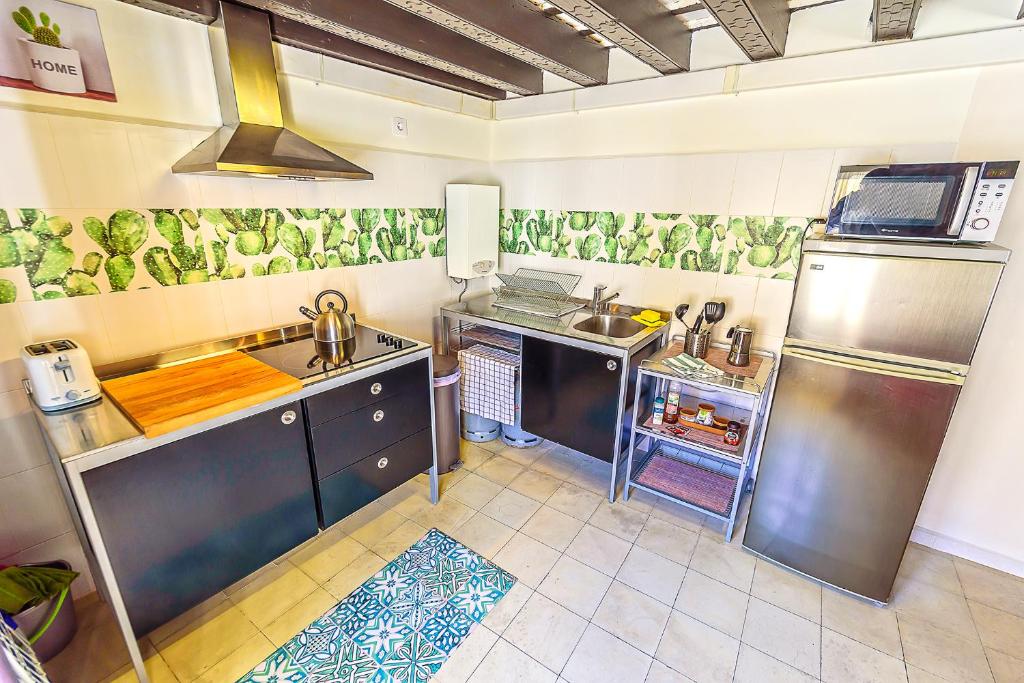 A kitchen or kitchenette at Milagros Central Apartments