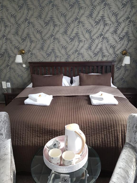 Łóżko lub łóżka w pokoju w obiekcie Hotel Amadeus