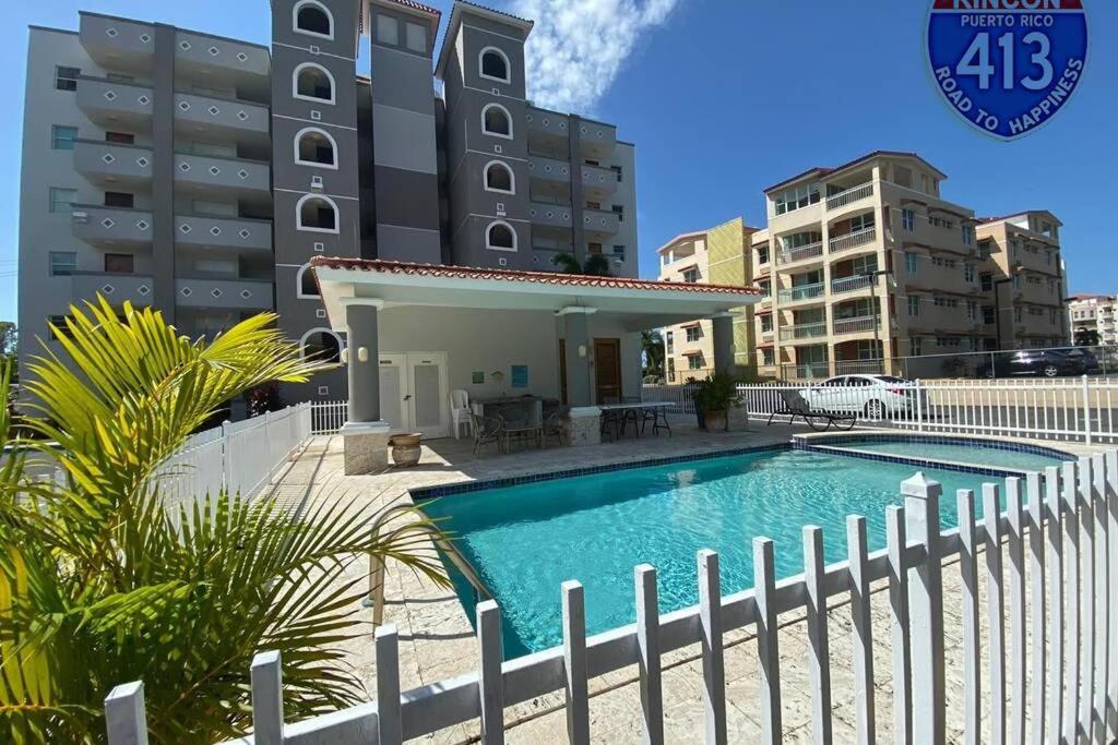 a swimming pool in front of a building at Wave View Village - Beach Front - Luxury Spot in Rincon