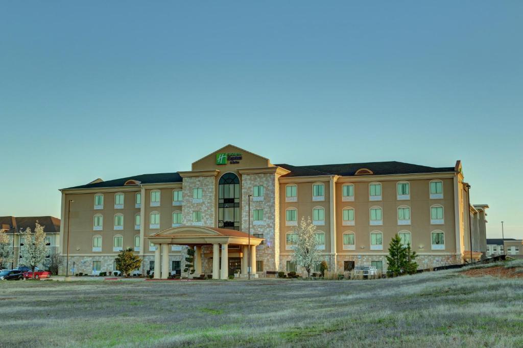 a large building with a large yard in front of it at Holiday Inn Express Hotel & Suites Texarkana East by IHG in Texarkana