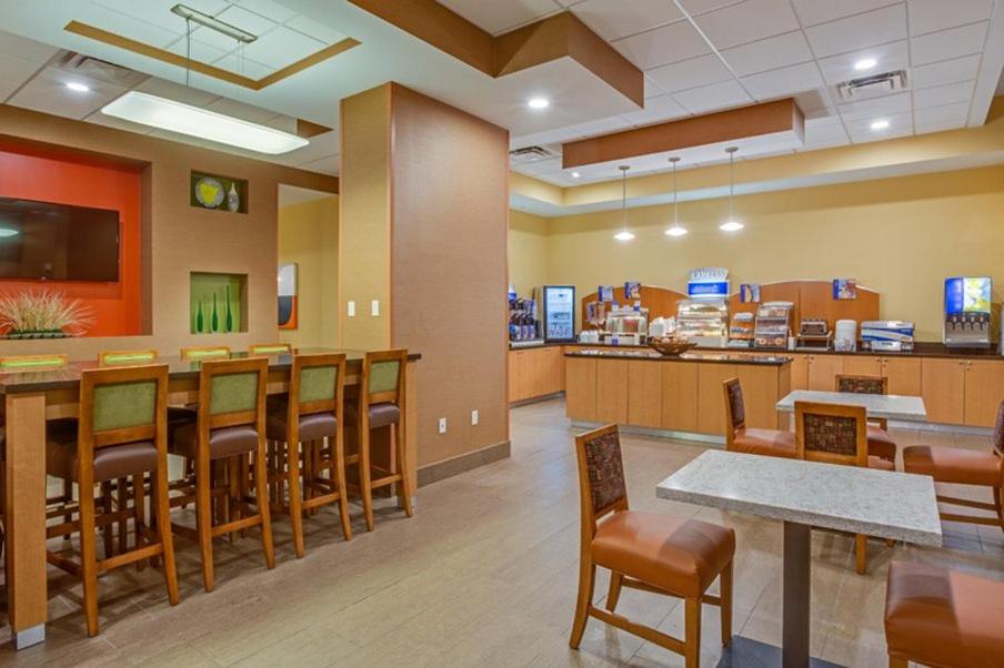 a waiting room at a fast food restaurant at Holiday Inn Express Fort Lauderdale Airport South by IHG in Dania Beach