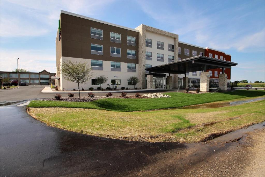 a large building with a road in front of it at Holiday Inn Express & Suites Fond Du Lac, an IHG Hotel in Fond du Lac