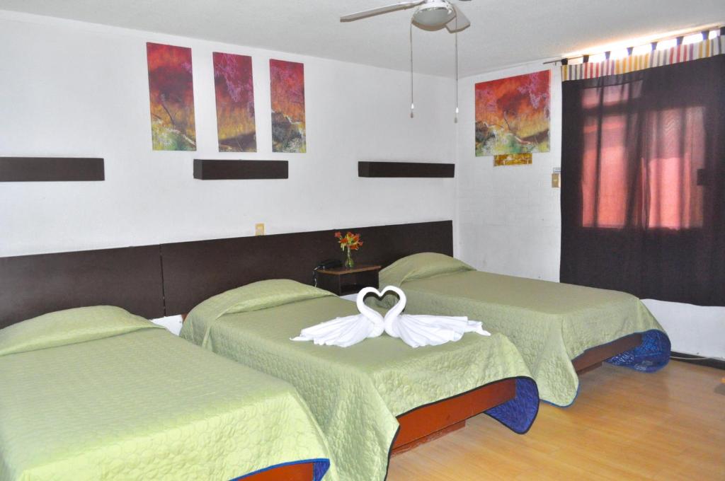 Postel nebo postele na pokoji v ubytování Hotel Trevi