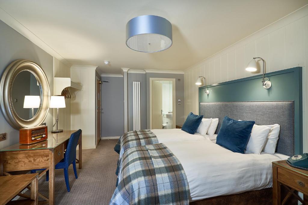 Letto o letti in una camera di Oban Bay Hotel