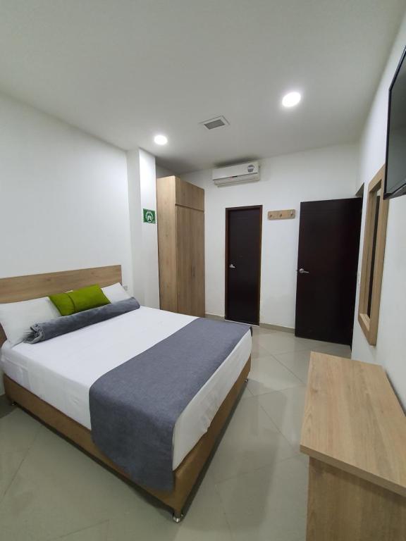 Postel nebo postele na pokoji v ubytování Hotel Laureles Park