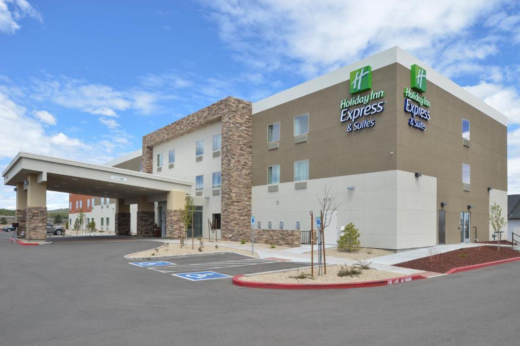 a hotel front of a building with a parking lot at Holiday Inn Express & Suites Williams, an IHG Hotel in Williams