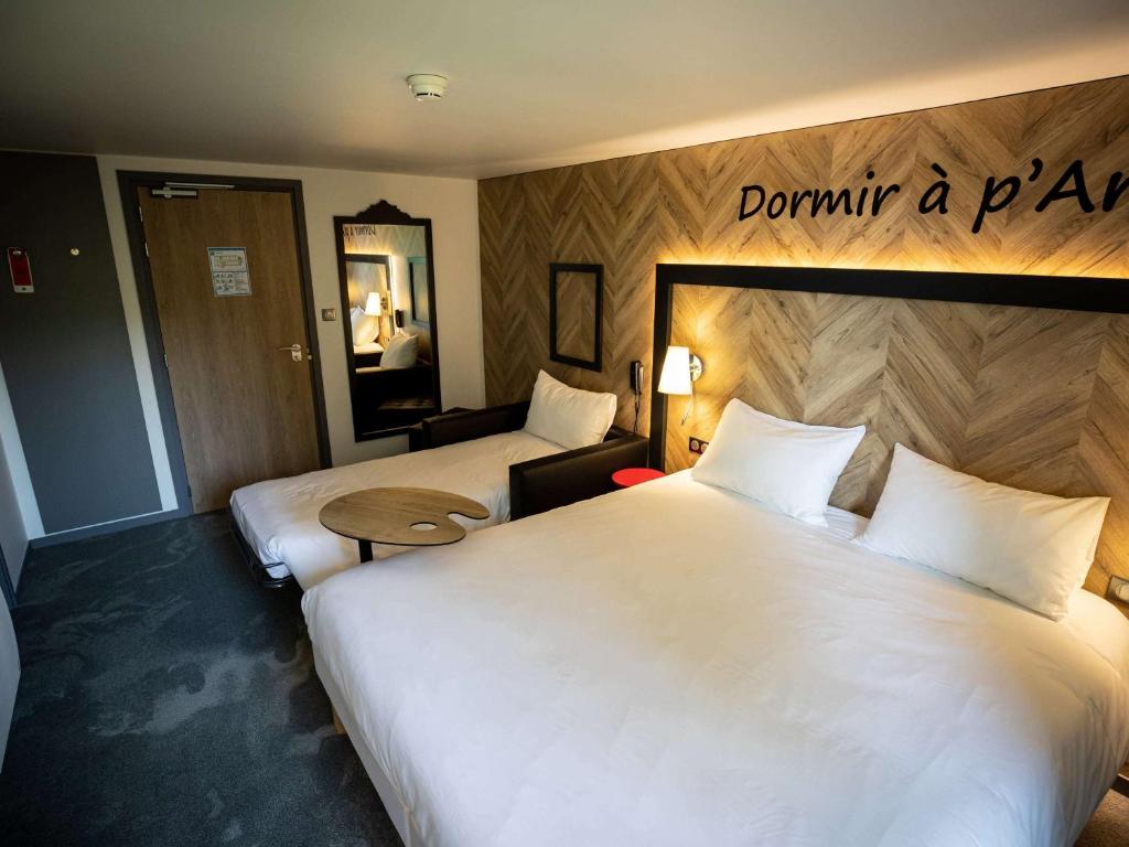 Postel nebo postele na pokoji v ubytování ibis Styles Douai Gare Gayant Expo