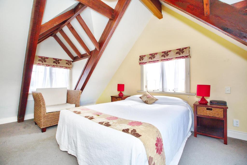 Postel nebo postele na pokoji v ubytování Warkworth Lodge