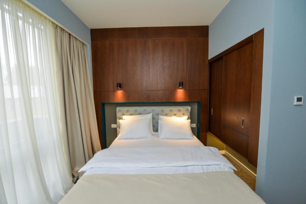 Postel nebo postele na pokoji v ubytování River View Hotel Tbilisi