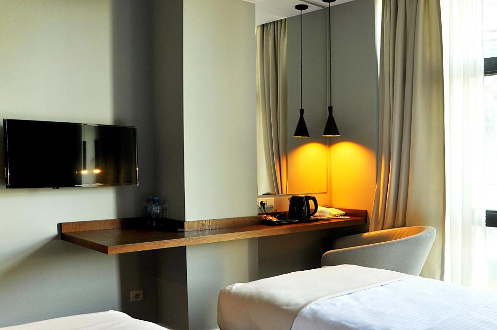 Postel nebo postele na pokoji v ubytování River View Hotel Tbilisi