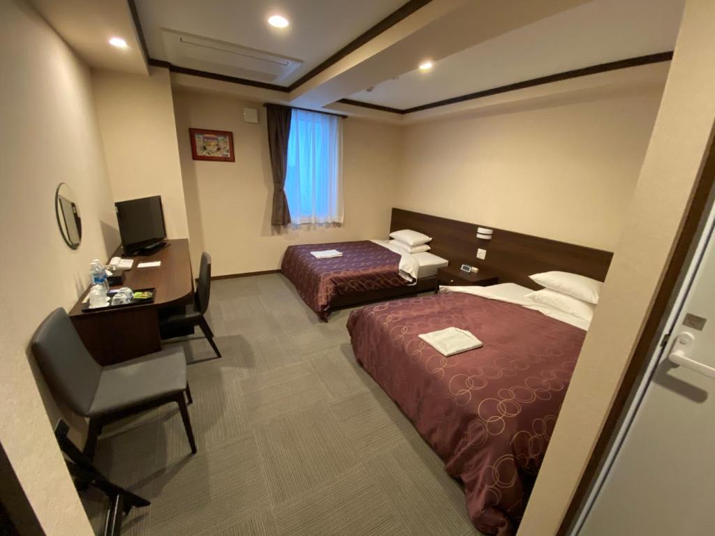 Postel nebo postele na pokoji v ubytování HOTEL SOSHA