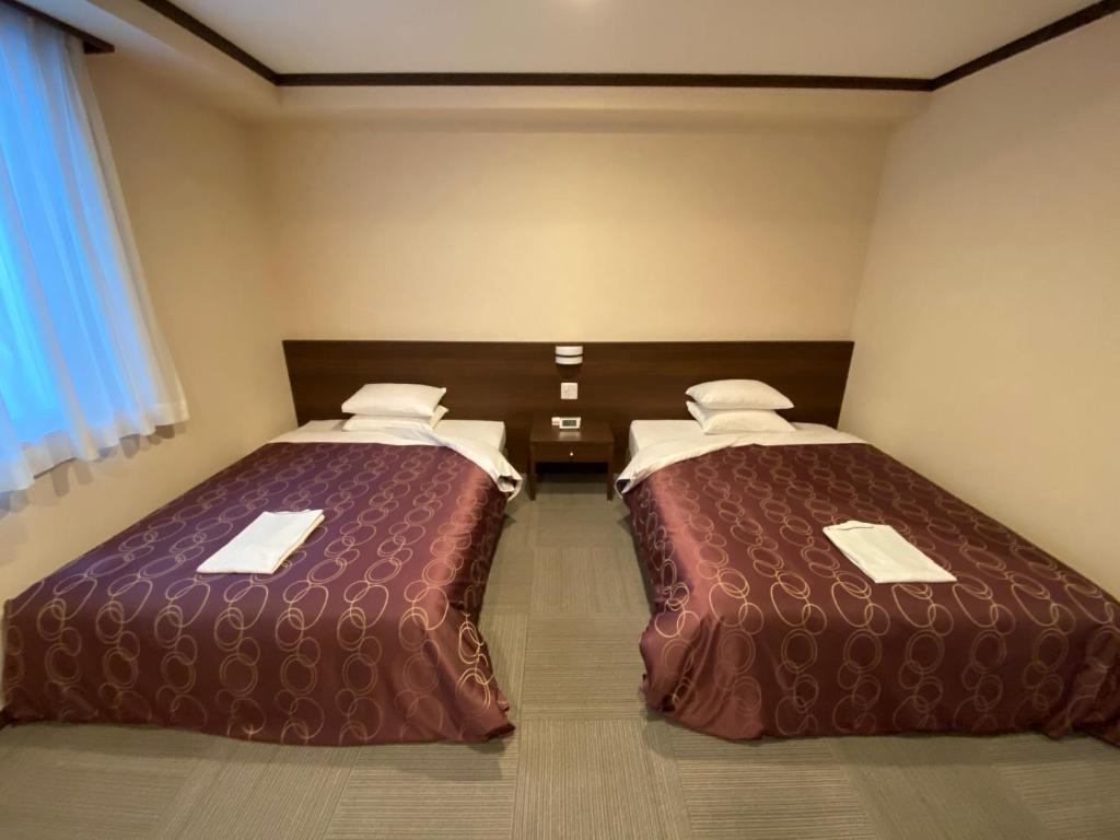 Postel nebo postele na pokoji v ubytování HOTEL SOSHA