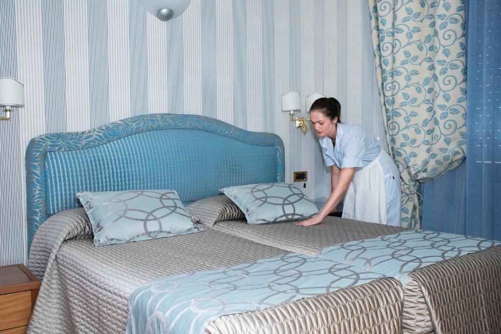 Postel nebo postele na pokoji v ubytování Hotel Europa