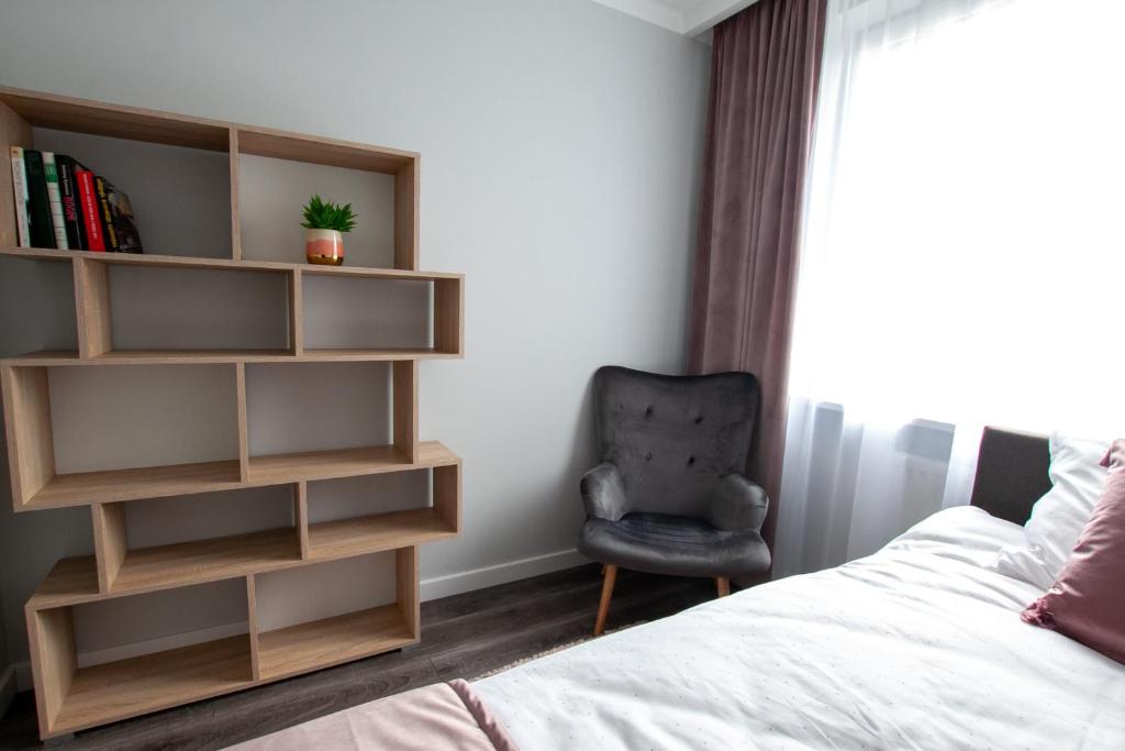 Łóżko lub łóżka w pokoju w obiekcie Apartament Leśny No 4 Blue
