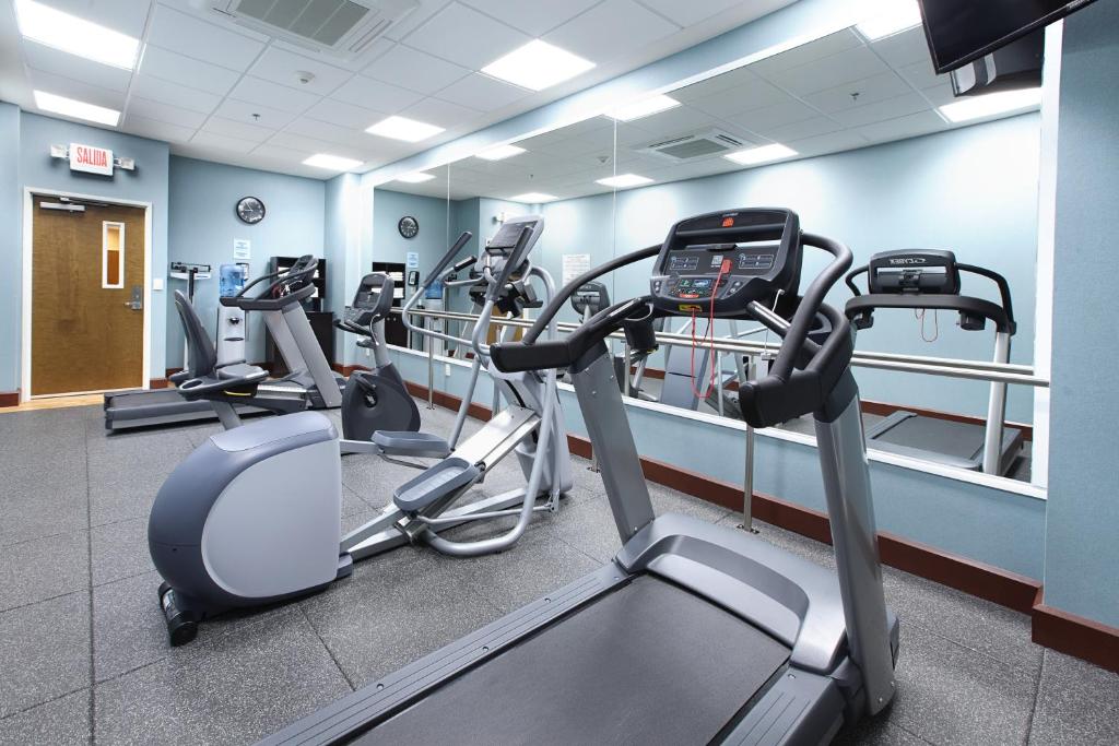 a gym with several cardio machines in a room at Holiday Inn Express & Suites Cuernavaca, an IHG Hotel in Cuernavaca