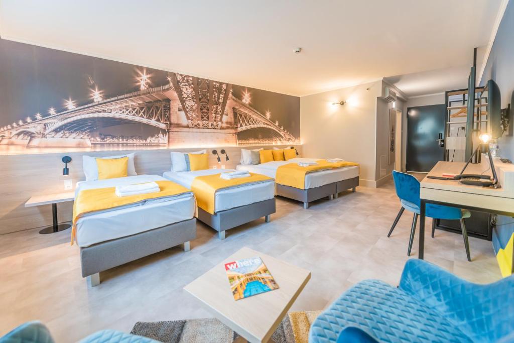 Postel nebo postele na pokoji v ubytování Impulso Fashion Hotel