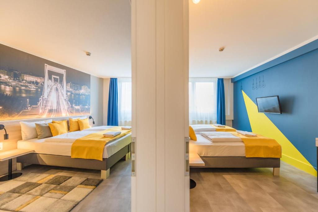 Postel nebo postele na pokoji v ubytování Impulso Fashion Hotel