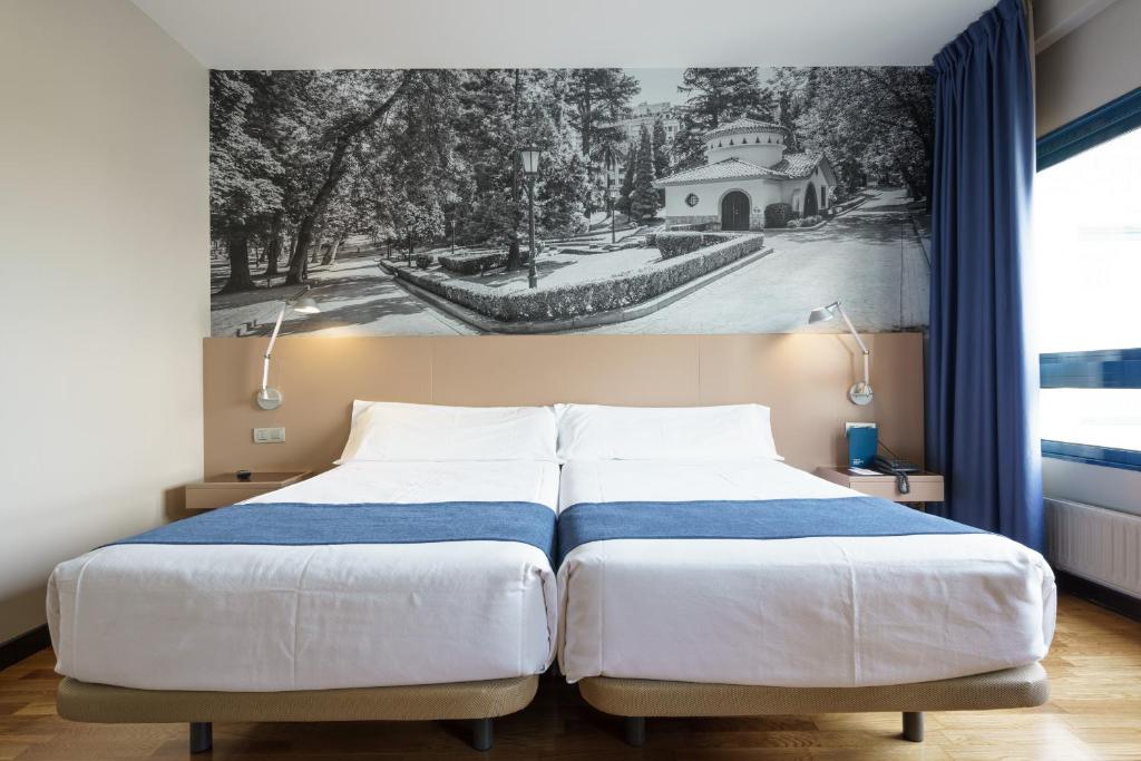 Postel nebo postele na pokoji v ubytování Aparthotel Campus