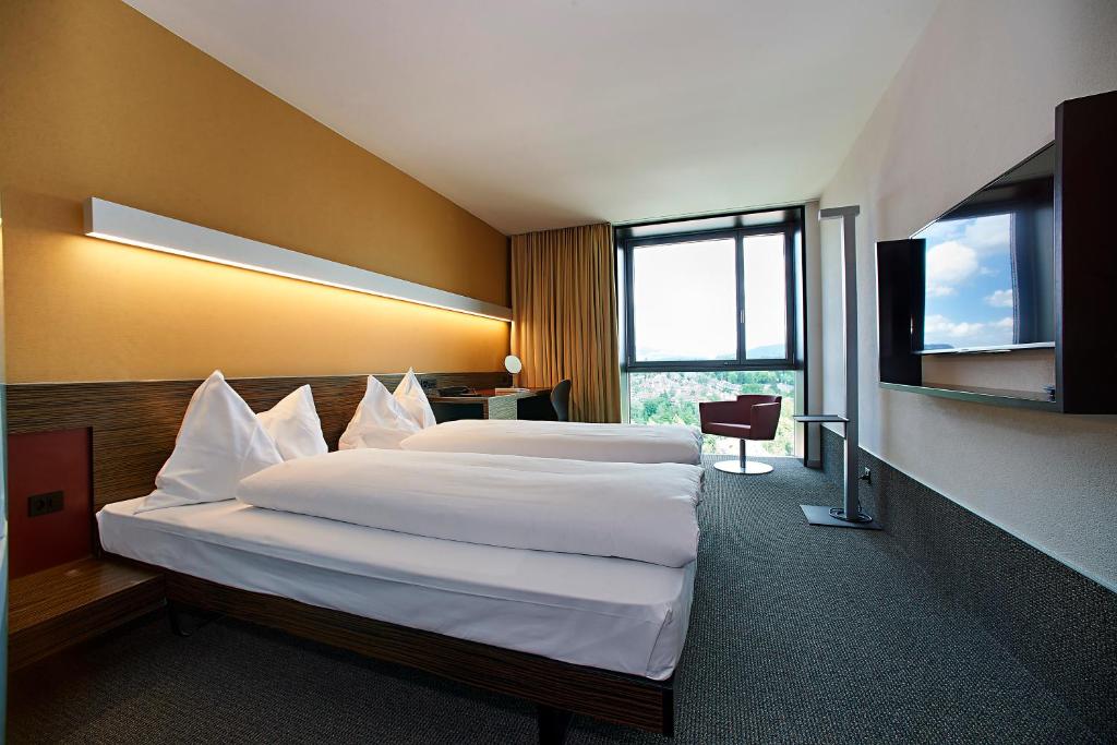 Postel nebo postele na pokoji v ubytování Hotel Ambassador