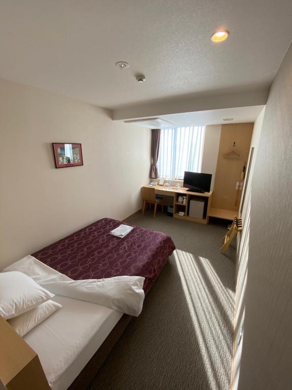 Postel nebo postele na pokoji v ubytování HOTEL SOSHA
