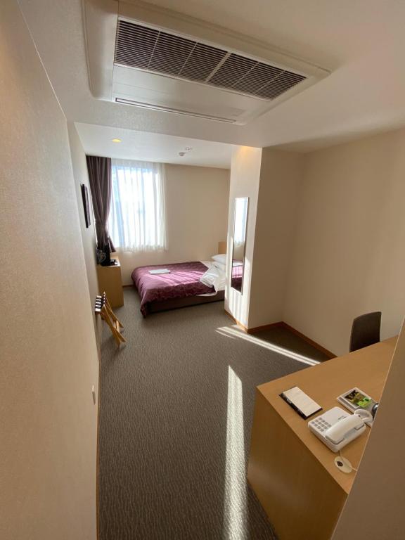 Postel nebo postele na pokoji v ubytování HOTEL SOSHA