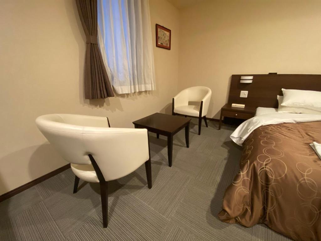 Postel nebo postele na pokoji v ubytování HOTEL SOSHA