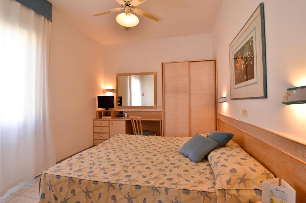 Postel nebo postele na pokoji v ubytování Hotel Aurora