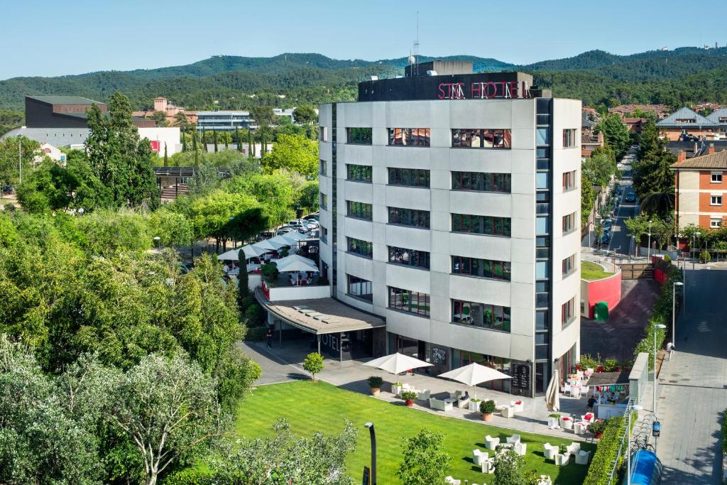 an aerial view of a building with a sign on it at Hotel Sant Cugat in Sant Cugat del Vallès