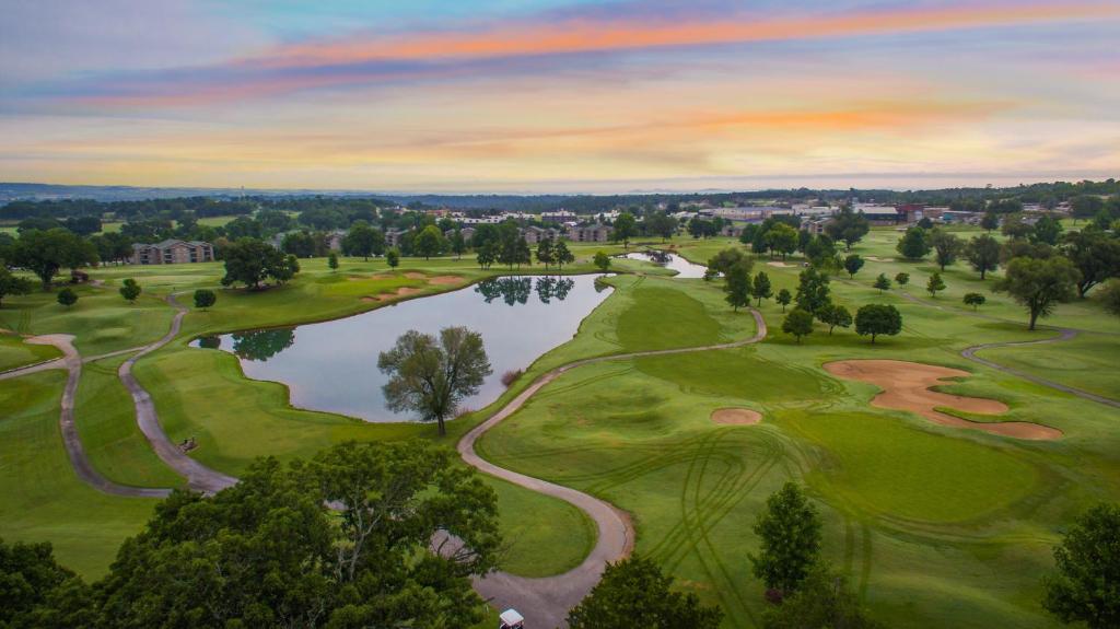 an aerial view of a golf course with a lake at Holiday Inn Club Vacations Holiday Hills Resort at Branson in Branson