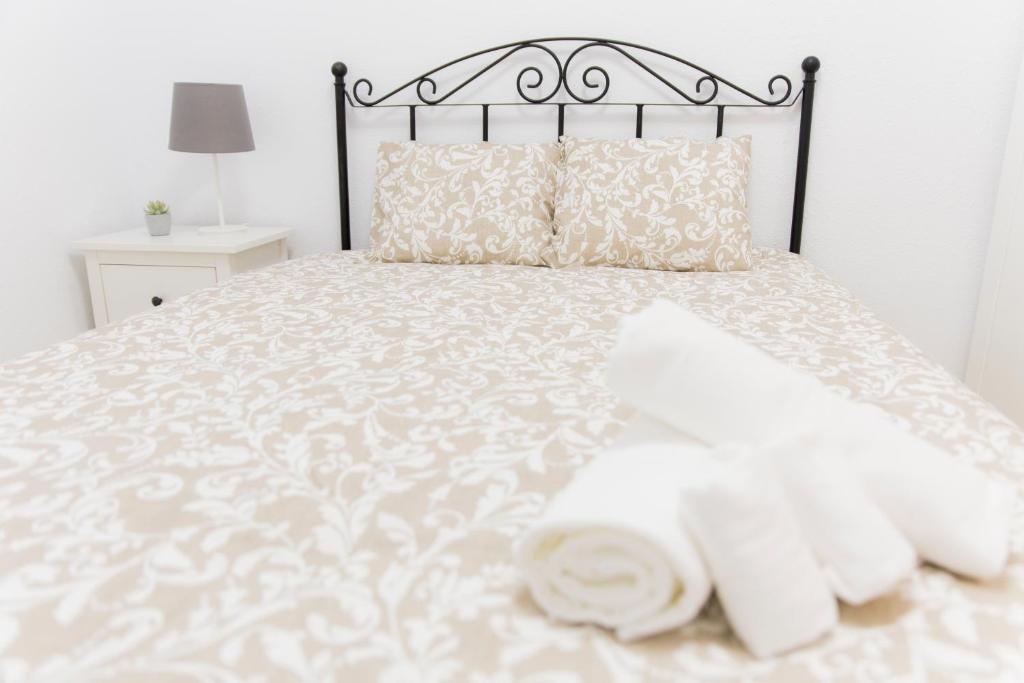 A bed or beds in a room at REFINO 11