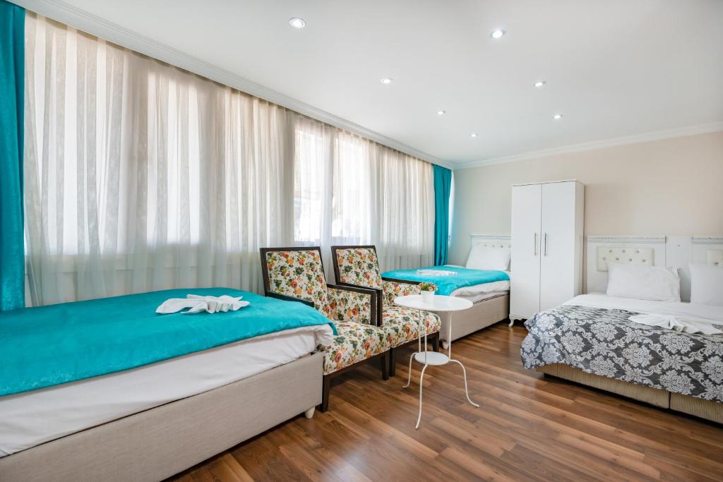 A bed or beds in a room at Nar Hotel