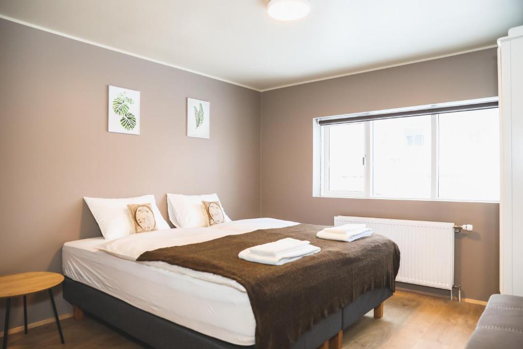 Postel nebo postele na pokoji v ubytování E18 Apartments