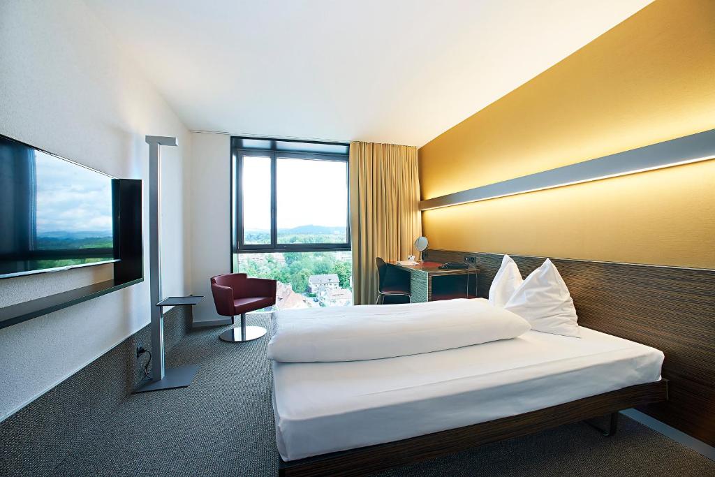 TV a/nebo společenská místnost v ubytování Hotel Ambassador