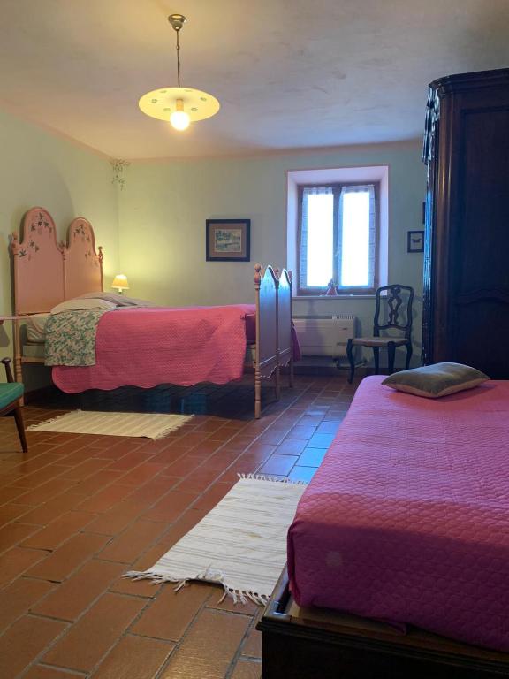 Postel nebo postele na pokoji v ubytování Cascina Alberta